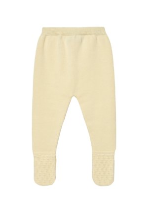 Pantalon en maille jaune douce pour bébé avec pieds fermés et taille élastique, avec des grips texturés sous les semelles pour éviter les glissades.
