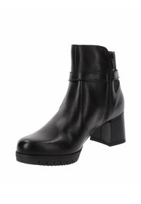 Stivaletto in pelle nera con tacco a blocco, chiusura con zip laterale e design elegante. Presenta una texture liscia e accenti minimalisti.