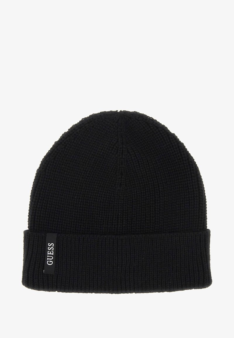 Black knit beanie with a ribbed texture, featuring a folded cuff and a small white logo tag labeled "GUESS" on the side.