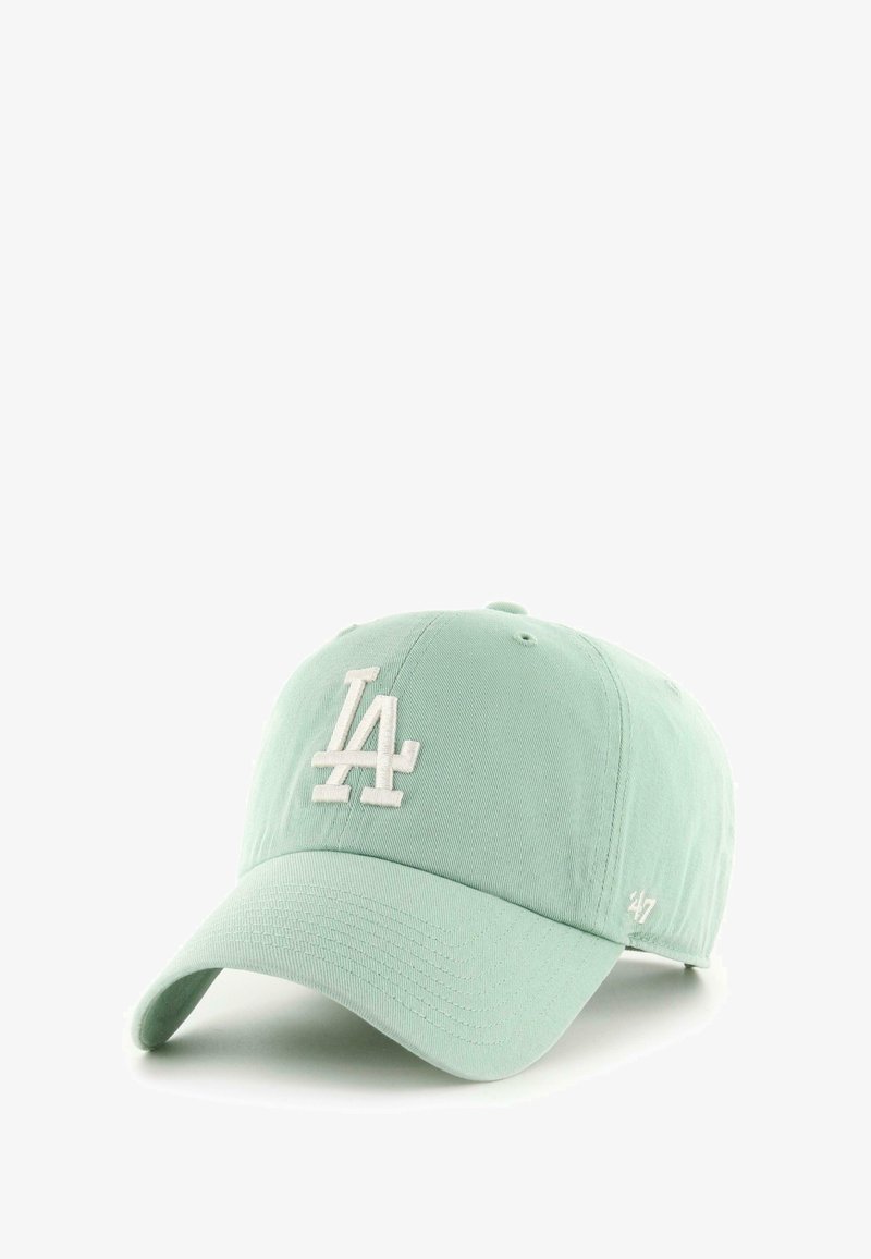 Light green baseball cap with white embroidered "LA" logo on front and small "47" logo on side brim, shown angled on white background.
