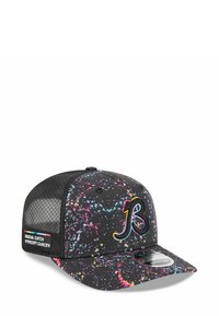 Black cap featuring a colorful splatter pattern, with a curved visor and black mesh backing. Logo and text on the side read "Crucial Catch."