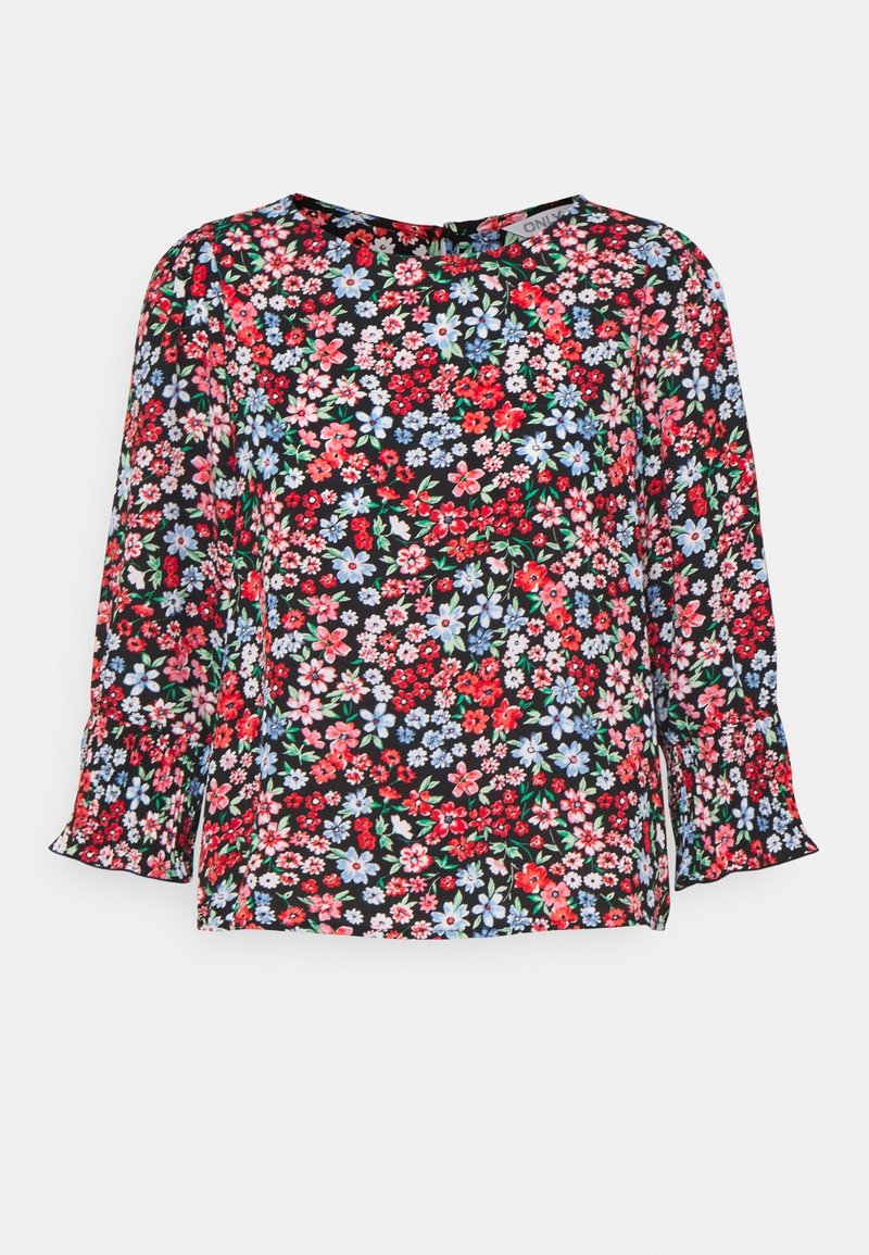 Blusa floreale con sfondo nero, caratterizzata da un mix di fiori rossi, rosa e blu. Maniche lunghe con polsini a volant e scollatura rotonda.