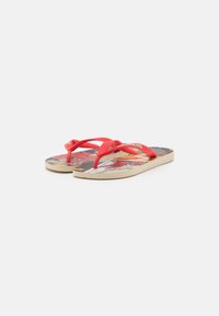 Infradito rossi con solette decorate da grafiche dei fumetti. Le cinghie sono in gomma flessibile e le suole sono testurizzate per una migliore aderenza.