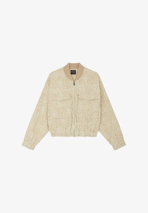 Chaqueta bomber beige con patrones de líneas abstractas blancas, puños elásticos y cinturilla, con cremallera frontal y dos grandes bolsillos.