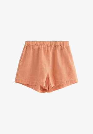 Orange rutiga shorts med elastisk midja, med en avslappnad passform och mjuk yta. Korta ben med sidöppningar.