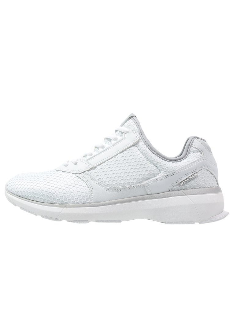 White athletic sneaker with textured mesh upper, lace-up design, cushioned sole, and brand name tag on the side.