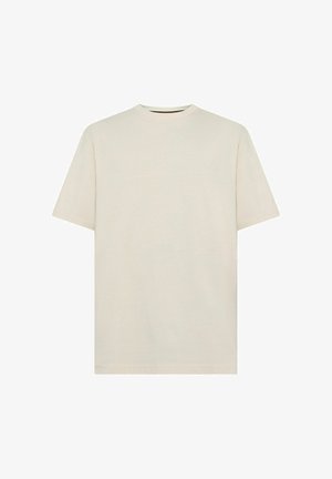 Jasno beżowa bawełniana koszulka z klasycznym okrągłym dekoltem i krótkimi rękawami. Prosty, bez zdobień design. Miękka tekstura, regularny krój.