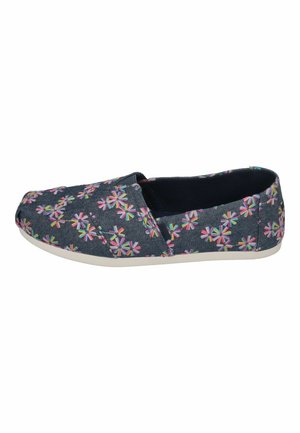 Navy fabric slip-on shoes featuring a multicolored floral pattern, round toe, and a white rubber sole. Smooth texture throughout.
