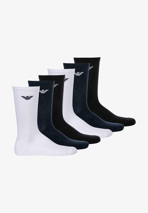 Seis pares de calcetines acanalados: dos blancos, dos azul marino y dos negros. Cada par presenta un pequeño logo encima del tobillo en un color contrastante.