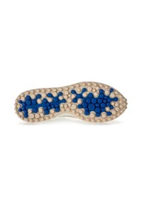 Semelle de chaussure avec une base beige présentant des motifs circulaires bleus en relief et des motifs en étoile pour l'adhérence, avec des surfaces texturées partout.