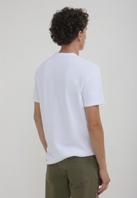 Calliope LAVORATO  - T-shirt basique - bianco