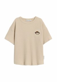 Vaaleanbeige lyhythihainen t-paita, jossa on vaahtomuovi-tekstuuri, pyöreä kaula-aukko ja kirjailtu apina-design vasemmalla rintamuksessa. Tagi sivussa.
