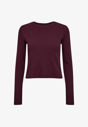 Burgunderfarbener Langarmoberteil aus Rippstoff; runder Ausschnitt und cropped Saum; mit eng anliegenden Ärmeln und glatter Textur.