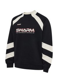 Black long-sleeve sweatshirt with white shoulder and sleeve stripes, "SWARM INTERNATIONALS" and "hummel SPORTSWEAR" logos on the front.