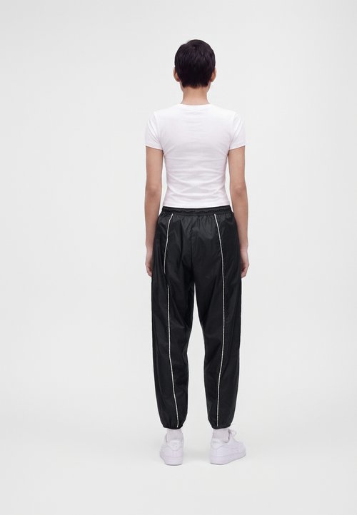 Nike ATHLETICS - Tracksuit bottoms - black/sail — foto 3