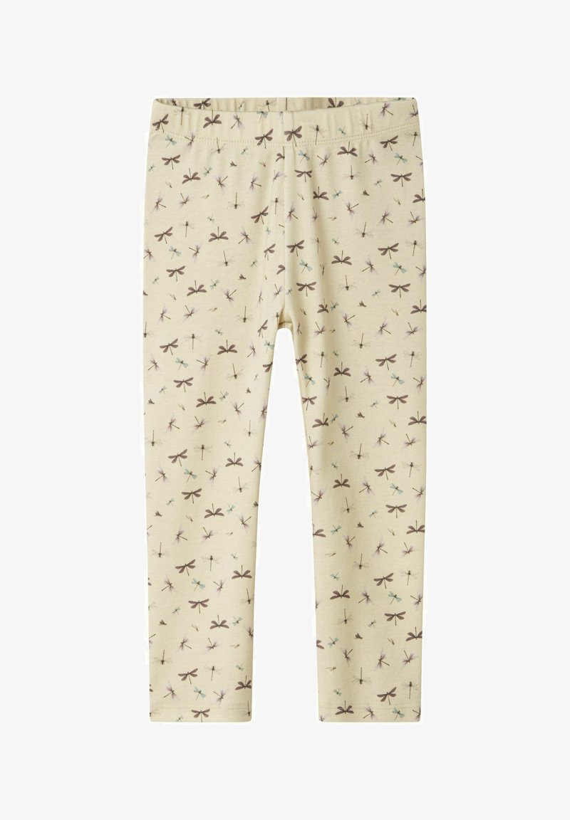 Light beige leggings with an elastic waistband, featuring a repeated dragonfly pattern in brown, blue, and purple. Soft cotton material.