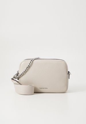 Beige leather crossbody bag with textured finish. Features a silver chain strap and fabric shoulder strap. Silver hardware accents.