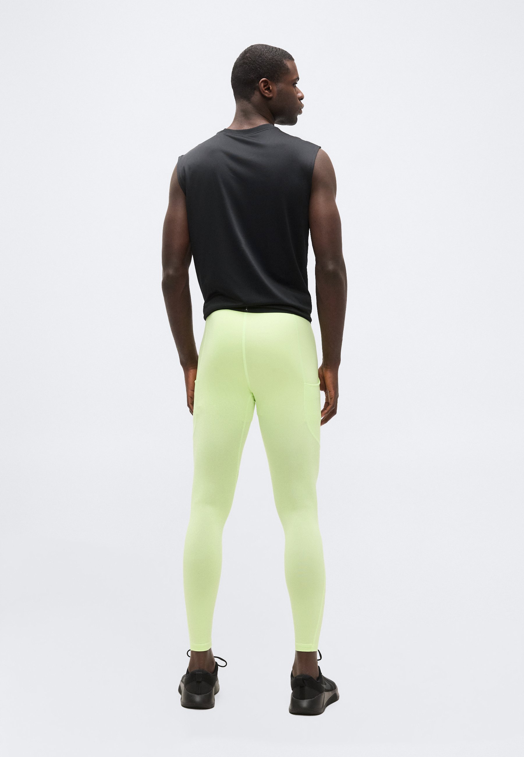 black and lime green nike leggings