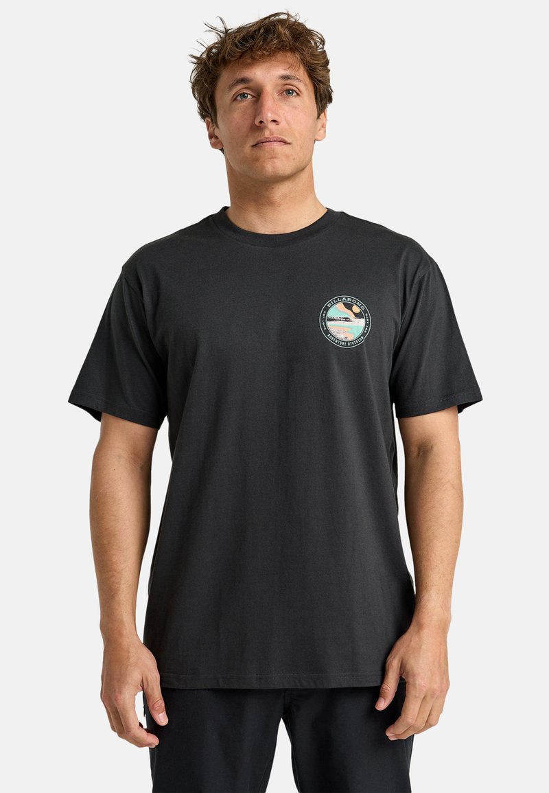 Black cotton t-shirt with short sleeves, round neckline, and a circular printed graphic on the left chest area featuring landscape elements.