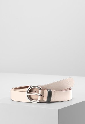 Light beige leather belt with round silver buckle and black belt loop, coiled on a white surface.