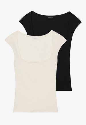 Two fitted short-sleeve tops: one black and one off-white. Both feature a square neckline and ribbed texture, with a smooth finish.