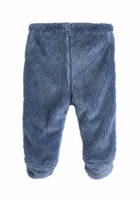 Fleece loungebyxor i mjuk blå färg, med elastisk midja, ribbade muddar och en strukturerad, plyschyta för värme och komfort.
