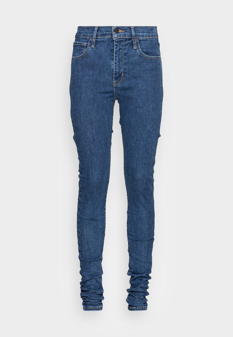 Schmale Jeans aus dunkelblauem Denim mit einem leicht verwaschenen Look, ausgestattet mit einem Reißverschluss, vorderen Taschen und gerafften Knöcheldetails.