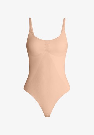 Seamless nude beige bodysuit with scoop neckline, adjustable straps, and snap closures at the crotch, designed for a smooth fit.