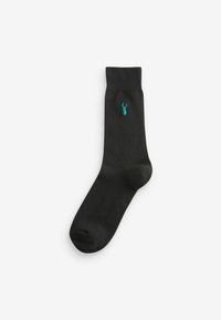 Chaussette noire en matériau lisse et extensible. Présente une petite broderie de homard turquoise au niveau de la partie médiane. Hauteur standard de type crew.