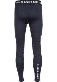 Leggings de sport noirs en tissu extensible, avec un logo sur la jambe inférieure et une large ceinture élastique avec une marque.