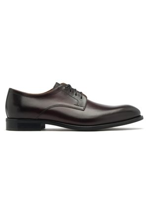 Brown leather dress shoe with a rounded toe, lace-up front, and a smooth finish. Features a low stacked heel and subtle stitched accents.