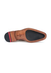 Brown leather shoe sole with a textured black rubber section and a red stripe. Features stitched detail and brass accent logo.