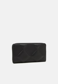 Black quilted wallet made of smooth material, featuring a rectangular shape with a zip-around closure and diamond pattern accents.