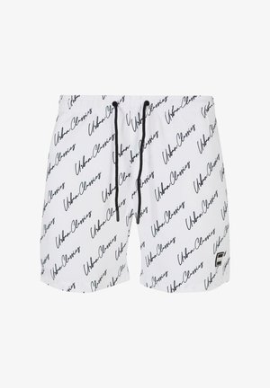 Weiße Badeshorts mit einem schwarzen Schriftmuster, das "Urban Classics" liest, mit einem Kordelzug am Bund und einem kleinen Logo-Patch.