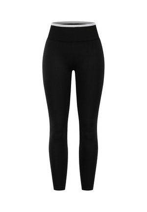 Zwarte naadloze leggings met een brede geribbelde tailleband en een slanke pasvorm, hoog in de taille, afgebeeld tegen een witte achtergrond.