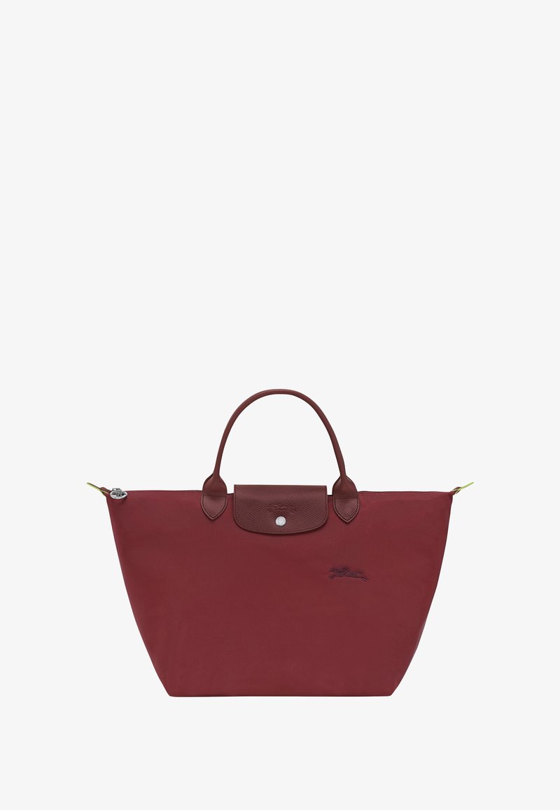 Burgundy tote bag with a smooth nylon body and textured leather accents. Features two rounded handles and a snap closure with logo details.