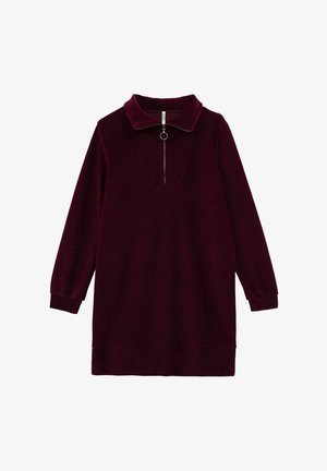 Abito in velluto a coste bordeaux con colletto, zip frontale a metà e maniche lunghe. Tessuto testurizzato con dettagli a costine verticali.