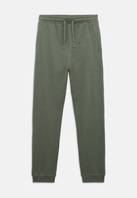 Πράσινες φόρμες φτιαγμένες από μαλακό ύφασμα, με ελαστική μέση και κορδόνι, πλαϊνές τσέπες και στενές μανσέτες στους αστραγάλους.