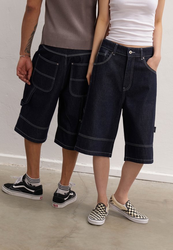 UNISEX - Denim shorts - rinsed denim