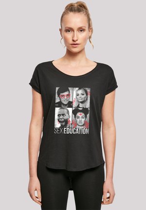 Black short-sleeve T-shirt featuring a graphic print with faces, red accents, and the text "SEX EDUCATION" in bold white lettering.