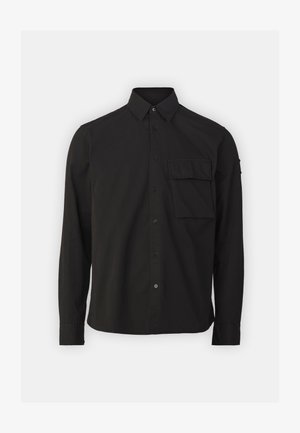 Camisa preta de manga longa feita de algodão, com colarinho abotoado, bolso frontal e um design de corte reto. Textura suave.
