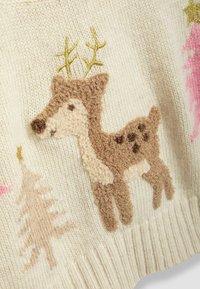 Beige knit sweater featuring an embroidered brown deer with textured accents, gold antlers, and pink tree patterns throughout.