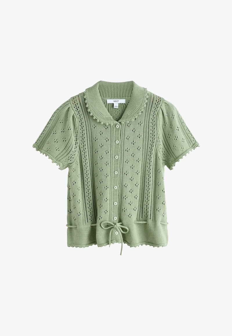Cardigan en maille vert clair à manches courtes avec boutons sur le devant, bords festonnés, motif ajouré, col côtelé et cordon de serrage à l'ourlet.