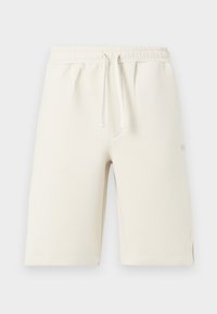 Shorts en coton beige clair avec taille élastique, cordon de serrage et poches latérales. Texture lisse, longueur genou avec ourlets cousus.