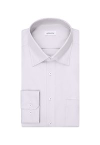 Camicia bianca testurizzata con colletto a punta, bottoni frontali e una tasca sul petto. Include un polsino piegato a sinistra.