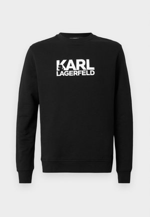 Black sweatshirt made of soft fabric featuring "KARL LAGERFELD" in large white letters on the front, with a round neckline and long sleeves.