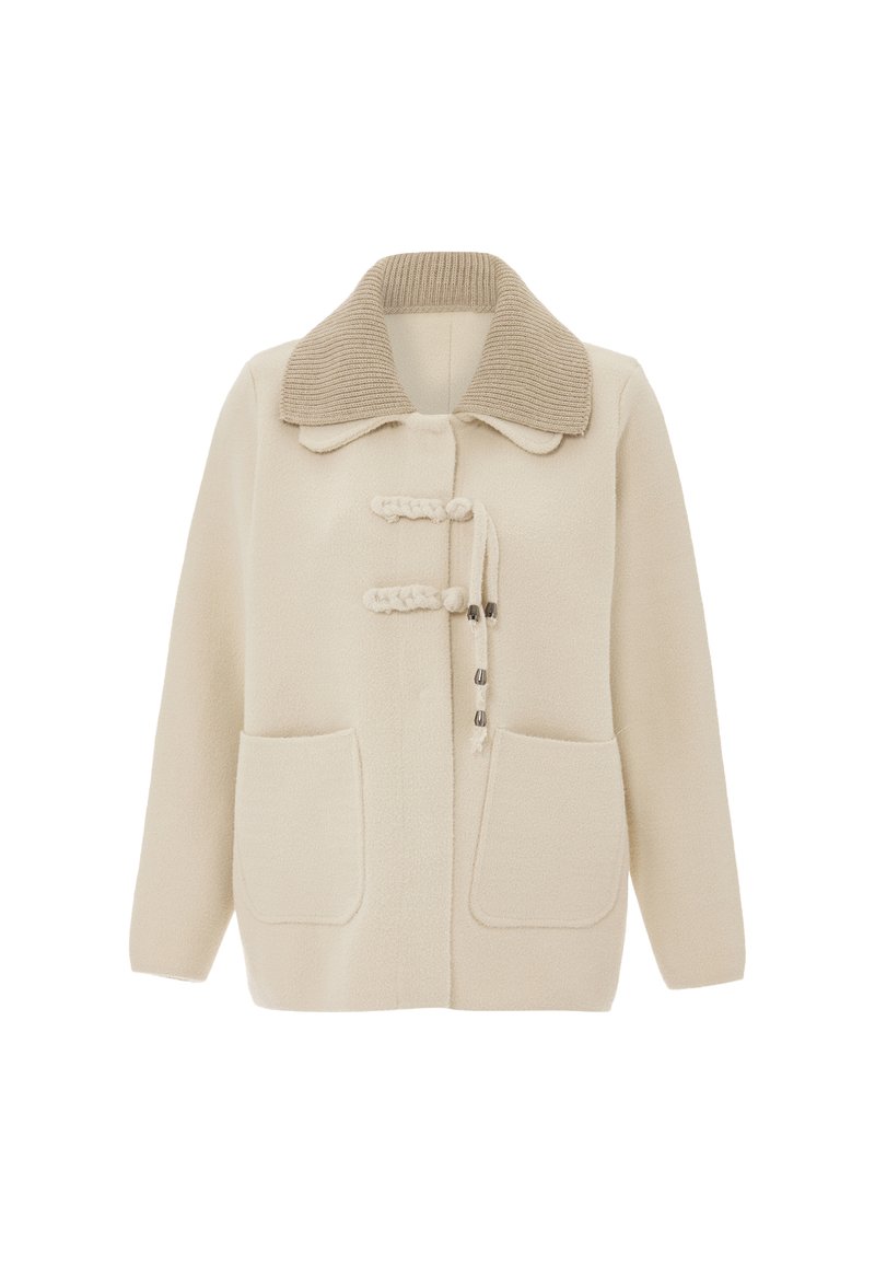 Beige villa sekoituksella oleva takki, jossa on ribattu kaulus, soljet ja kaksi etutaskua, pehmeällä kangassivulla ja rennolla leikkauksella.