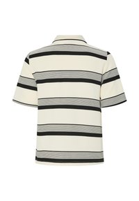 Korte mouwen polo shirt in licht crème met zwarte horizontale strepen. Heeft een klassieke kraag en een zachte katoentextuur.