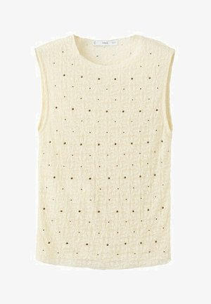 Top senza maniche in maglia color crema con motivo a quadrati testurizzati e piccoli fori distribuiti uniformemente su tutto il tessuto.