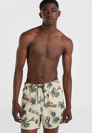 Beige Badehose mit einem tropischen Druck, der Palmen, Lastwagen und Kakteen zeigt; elastischer Bund mit Kordelzug. Glatte Stoffoberfläche.
